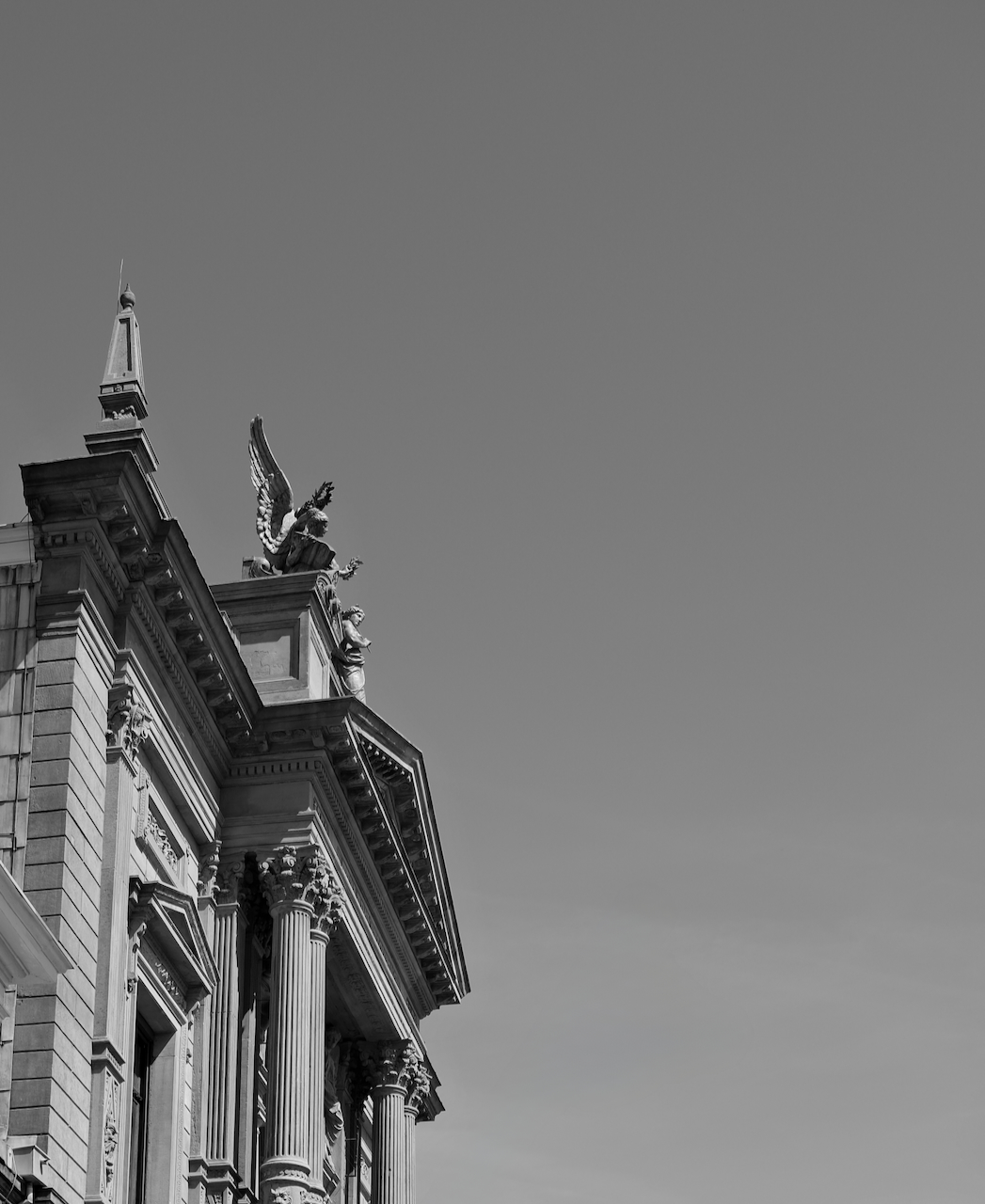 A black and white architectural detail against an open sky
