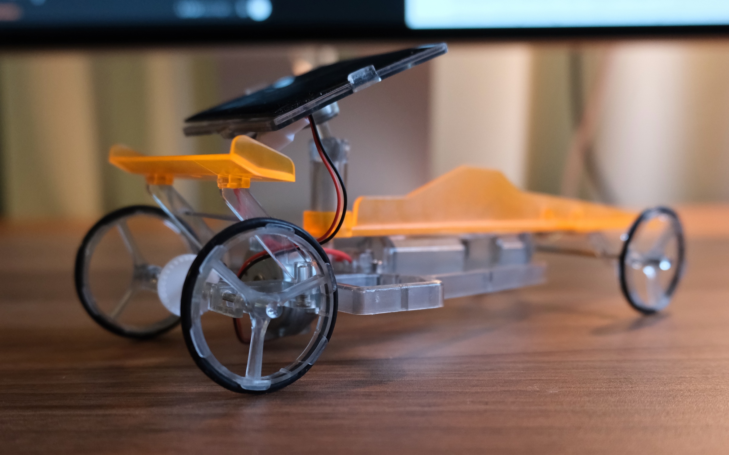 A close-up of a small solar-powered model car
